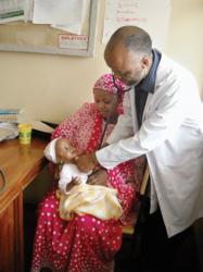 As a coffee grower with the Kilimanjaro Native Cooperative Union, Theresia John Kombe was able to join a MicroEnsure health plan that connected to a network of clinics. Now, she pays an $8 annual premium that covers the whole family.